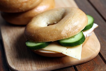 Image showing fresh cheese and ham bagel 