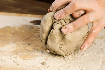 Image showing Child hands of a potter