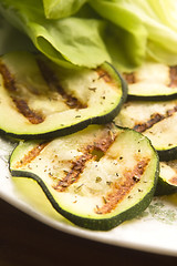 Image showing Grilled organic zucchini slices with herbs and spices