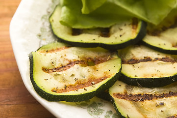 Image showing Grilled organic zucchini slices with herbs and spices