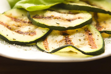 Image showing Grilled organic zucchini slices with herbs and spices