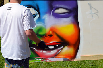 Image showing graffiti draw. Man with flask draw colorful face 