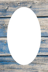 Image showing Old blue painted planks frame and isolated oval 