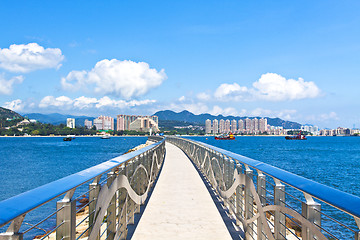 Image showing Walkway along the coast with Hong Kong skyline