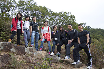 Image showing Asian hiking teams in mountains