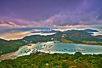 Image showing Mountain sunset in island with power plant