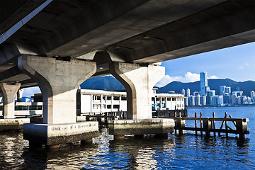 Image showing Hong Kong skyline along the seashore under bridges