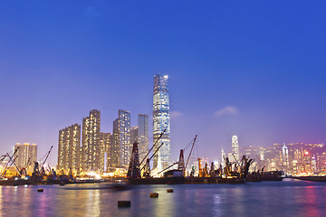 Image showing Hong Kong harbor at sunset with industrial ships