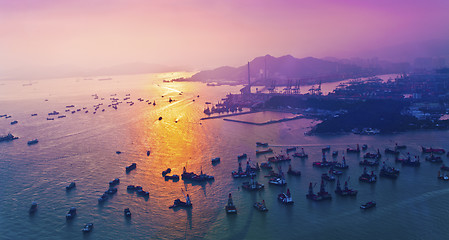 Image showing Sunset coast in container terminal and bridges 