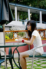 Image showing Asian student reading book in school