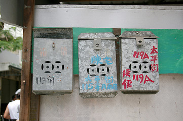 Image showing Chinese postboxes hanging on wall