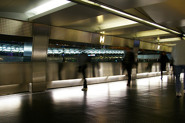 Image showing Moving pedestrian in footbridge