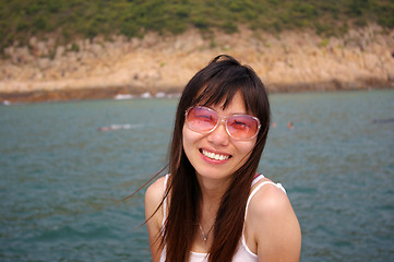 Image showing Asian woman smiling with sunglasses in summer