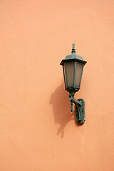 Image showing Orange lamp on wall