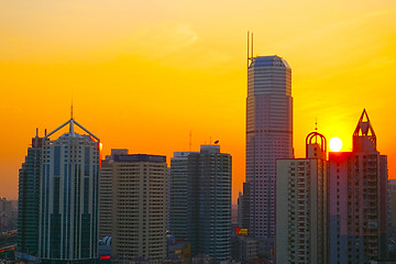 Image showing Shanghai sunset with skyscrapers background