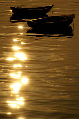 Image showing Boats over the ocean at sunset