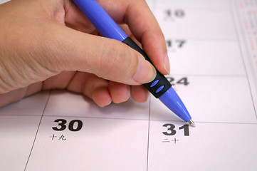 Image showing Human hand writing calendar