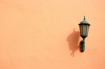 Image showing Orange lamp on wall