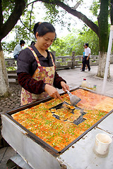 Image showing Chinese woman selling tofu on street