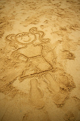 Image showing Girl drawing on beach