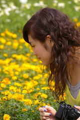 Image showing Asian woman looking flowers