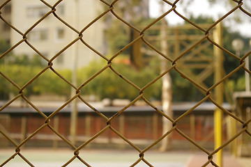 Image showing Basketball court through the net