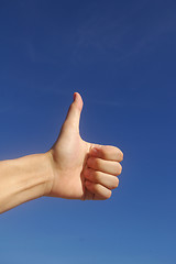 Image showing Thumbs up in blue sky