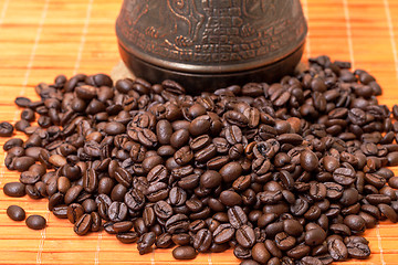 Image showing Cezve and Coffee Beans on Bamboo Mat