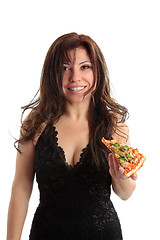 Image showing Woman holding a slice of pizza