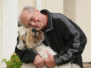 Image showing Happy senior man and his dog