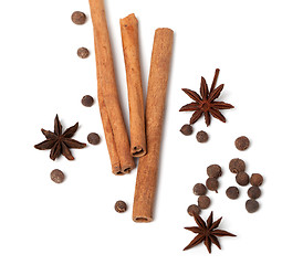 Image showing Cinnamon sticks, anise stars and black peppercorns