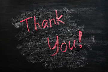 Image showing Thank you written with red chalk on a smudged blackboard