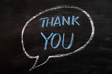 Image showing Thank you written with blue chalk on a smudged blackboard