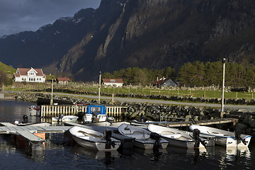 Image showing small harbor with mountains in background