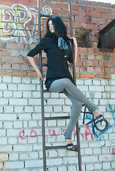 Image showing Pretty girl on ladder