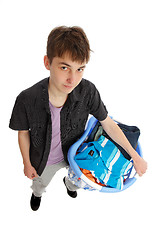 Image showing Teenager with basket of clothing