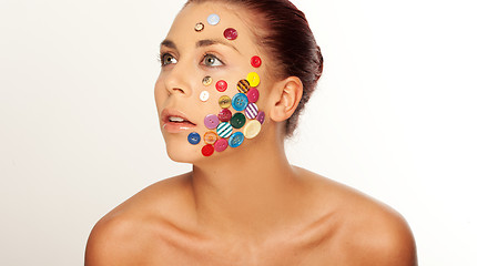 Image showing Woman with buttons on her face