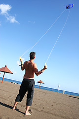 Image showing Flying a Kite