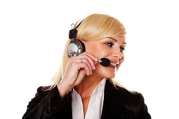 Image showing Smiling woman using headphones and mike