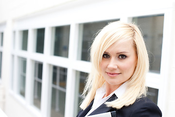 Image showing Pretty blonde businesswoman with paperwork