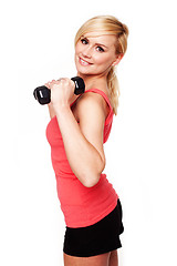 Image showing Pretty girl keeping her beautiful shape exercising