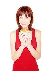 Image showing Happy Woman Holding Large Muffin