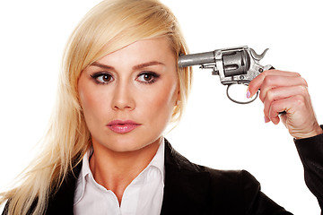 Image showing Woman holding a gun to her head