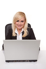 Image showing Smiling secretary at her laptop