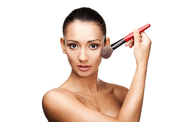 Image showing Young beautiful woman applying makeup