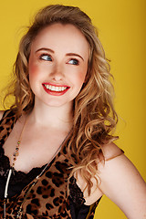 Image showing smiling woman wearing top with leopard prints