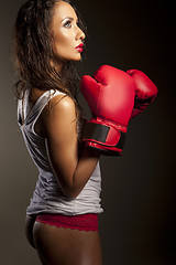 Image showing Sexy woman boxer pausing during training