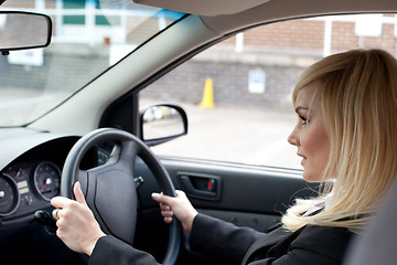 Image showing Beautiful businesswoman driving a car