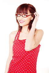 Image showing red haired woman wearing red dress with polka dots