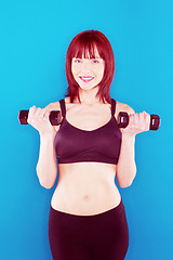 Image showing Woman Holding Pair Of Dumbbells